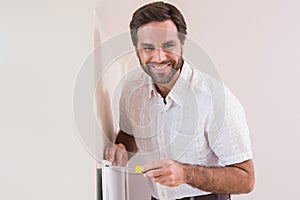 Handyman hanging up a radiator