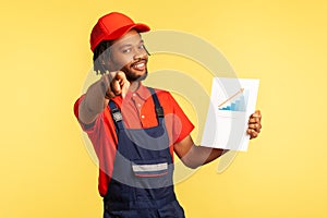Handyman holds chart showing increase of workers salaries, inviting you to work in service industry
