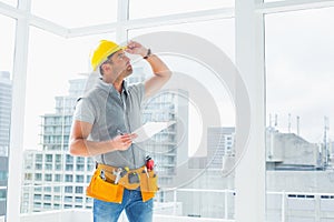 Handyman inspecting building