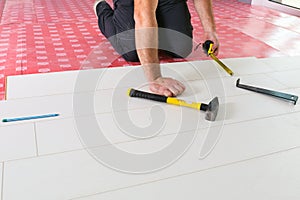 Handyman installing new laminated floor