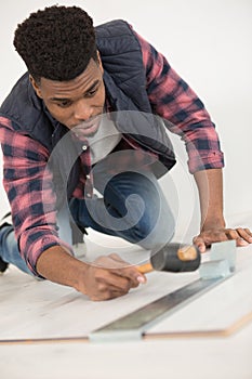 handyman installing wooden floor