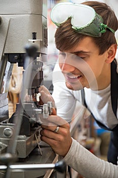 Handyman making door keys copies