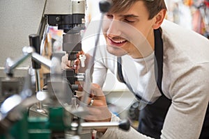 Handyman making door keys copies