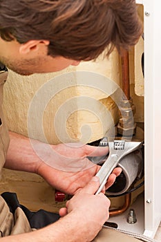 Handyman mending pipes photo