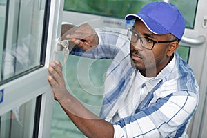 Handyman repair door lock in room