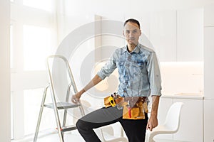 handyman with tool belt with construction tools