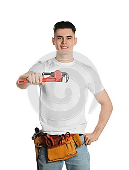 Handyman with tool belt and pipe wrench isolated on white