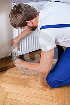 Handyman trying to fix heater