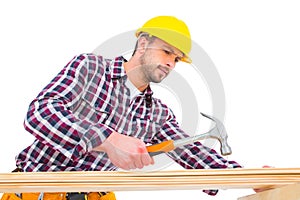 Handyman using hammer on wood