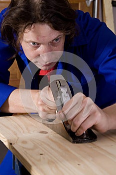 Handyman using plane