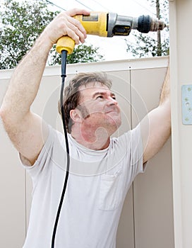 Handyman Using Power Drill