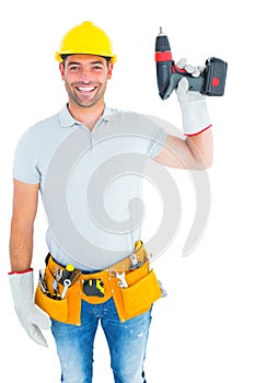 Handyman wearing tool belt while holding power drill