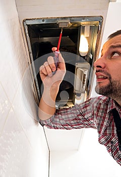 Handyman work on ventilation in the kitchen