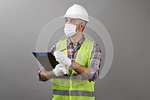 Handyman worker checking the list on the clipboard