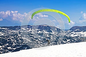 Hang - glider in Austrian Alps taken in winter.