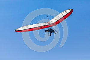 Hang glider flight against the blue sky