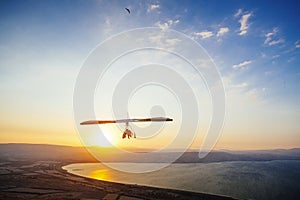 Hang-glider  flight in sky in sunset time over the Kineret, Mevo Hama photo