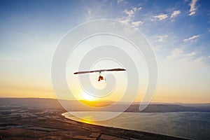 Hang-glider  flight in sky in sunset time over the Kineret, Mevo Hama photo