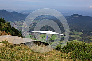 A hang glider flying in the German Alps