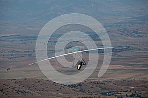 Hang glider flying in the mountains in Makedonia