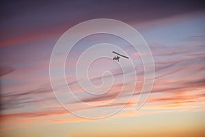 Hang glider flying with pilot