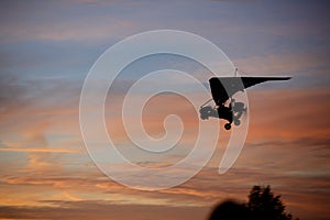 Hang glider flying in sky