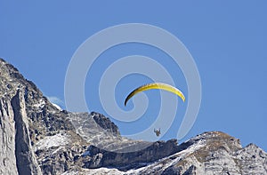 Hang Glider jumping from swiss mountain.