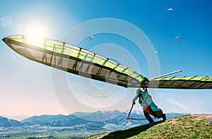Hang glider launch from top of hill