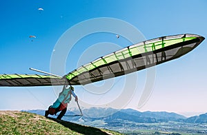 Hang glider launch from top of hill