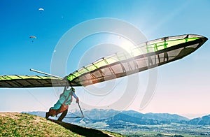 Hang glider launch from top of hill