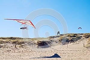 Hang glider over beach