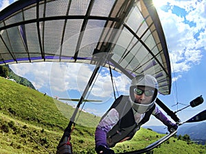 Hang glider pilot after take-off from a hill