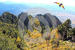 A Hang-Glider Soars the Sandia Mountains in Autumn