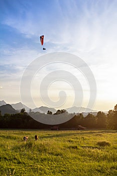 Hang gliding above the field