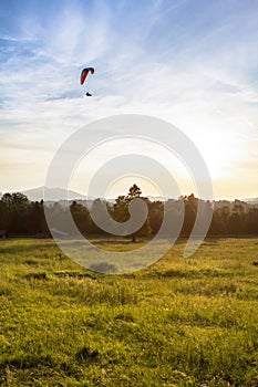 Hang gliding above the field
