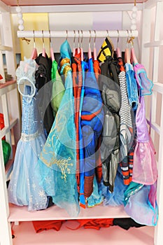 Hanger with carnival costumes for children.