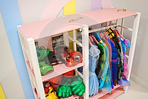 Hanger with carnival costumes for children.