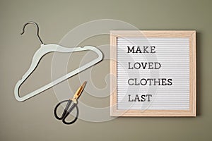 Hanger with letter board and text made loves clothes last. Slow fashion, circular economy