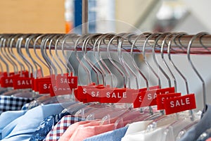 Hangers with advertising about sales in store