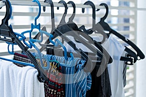 Hangers with clothes drying on the balcony