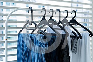 Hangers with clothes drying on the balcony