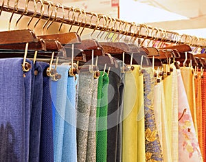 hangers with fabrics and tablecloths on sale in the haberdashery