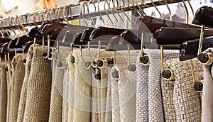hangers with woven fabrics and tablecloths on sale photo