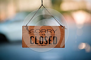 Hangging wooden sign sorry we are closed please come back again