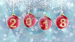 Hanging 2018 number glitter Christmas balls on blue bokeh background. 4K