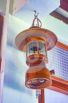 hanging antique wooden Petromax lamp decoration photo