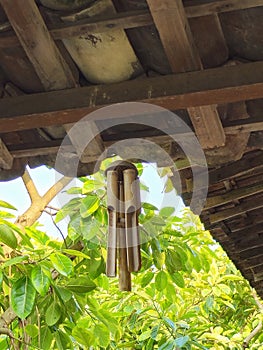 Hanging bamboo decorations, creating melodious tunes as they sway and collide with the breeze. photo