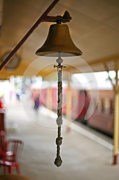 Hanging bell with cord for ringing