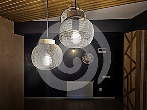 Hanging black globo lighting photo