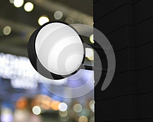 Hanging black rounded signboard mockup over blur light and shadow of shopping mall, 3D rendering